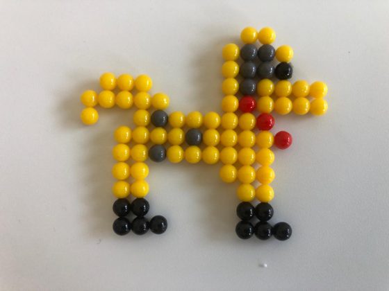 A dog character created from the magic beads game